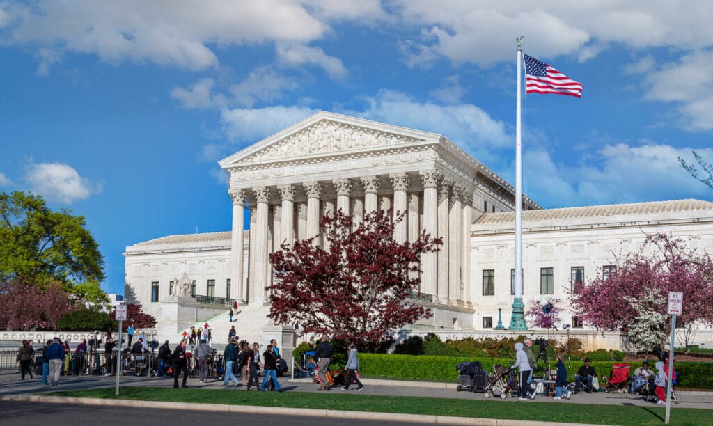U.S. Supreme Court Building with Activists, the Press and Sightseeing Tourists in Front of the Court, Washington DC. 