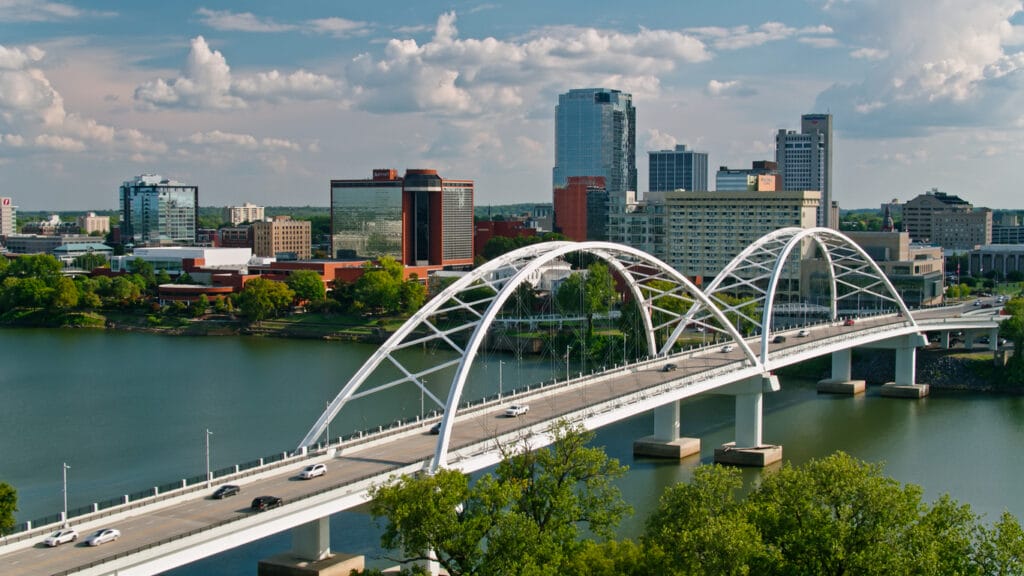 Aerial shot of the Broadway Bridge across the Arkansas River and the skyline of downtown Little Rock, Arkansas. 
