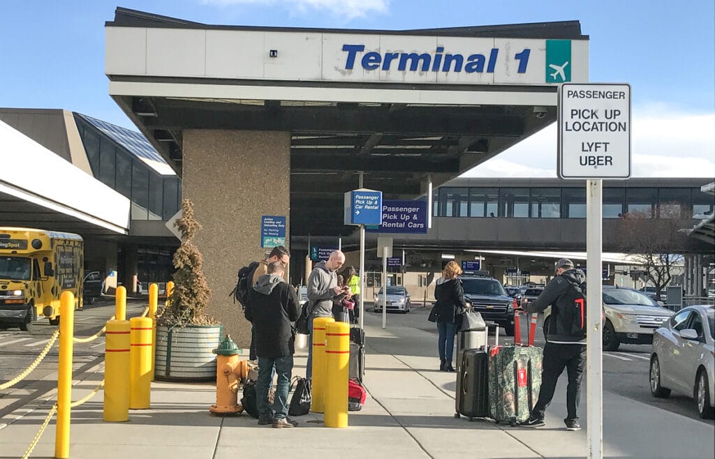 Salt Lake City, UT, 2/4/2019: Passengers are waiting at the Uber and Lyft designated pick up stop at SLC's Terminal 1.