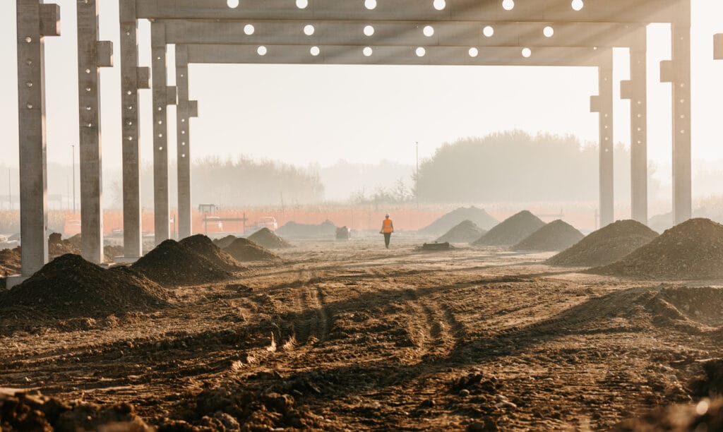 Frame structure at under construction site on rural landscape