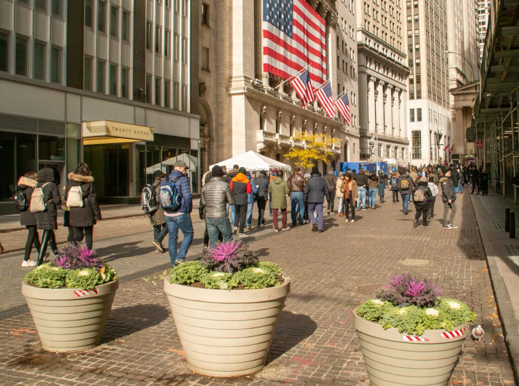 New York, 2019. Guided tourists visiting the New York Stock Exchange in the financial district.