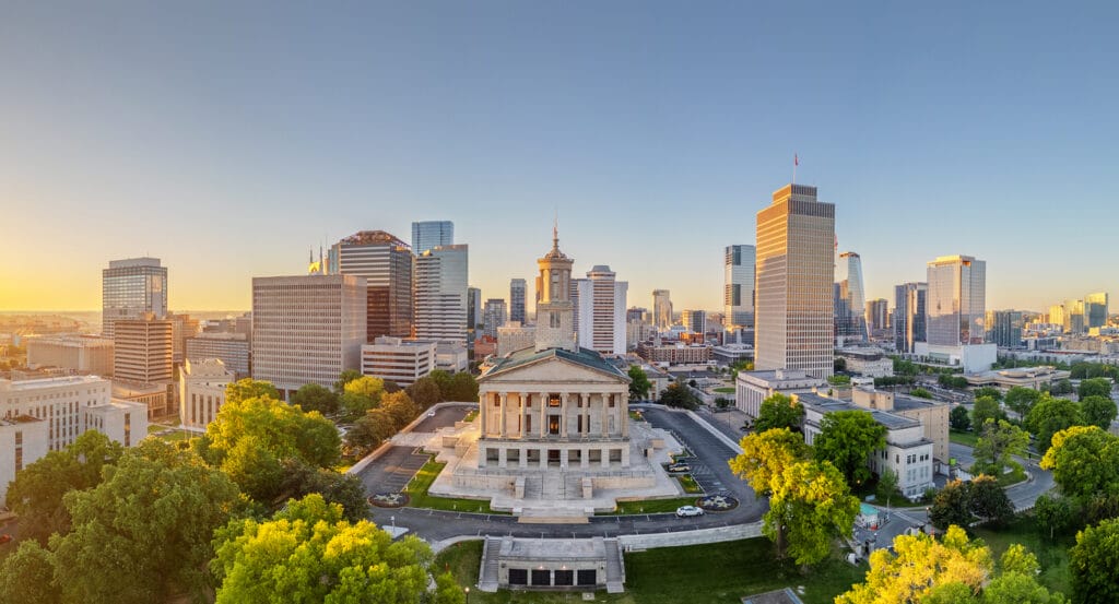 Nashville, Tennessee, USA downtown city skyline with the state capitol at dawn.