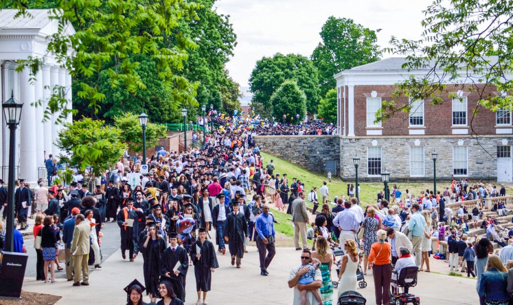 Charlottesville: Crowd of people walking by amphitheater at graduation ceremony at University of Virginia