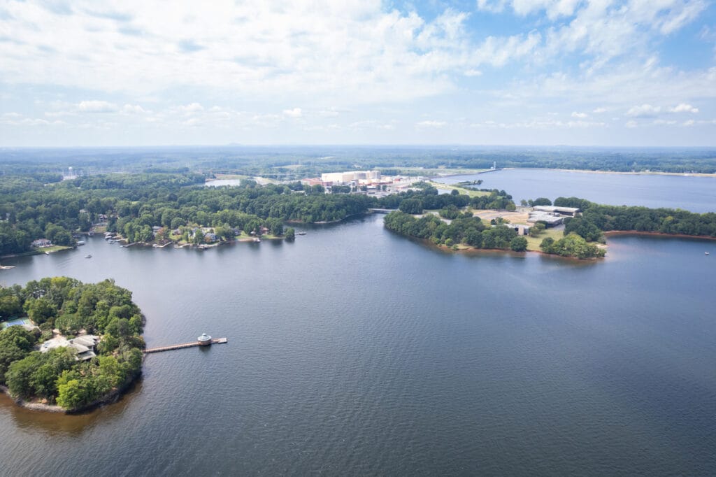 Drone view of Lake Norman near Charlotte, North Carolina in the summer, with the McGuire Nuclear Station in the background.