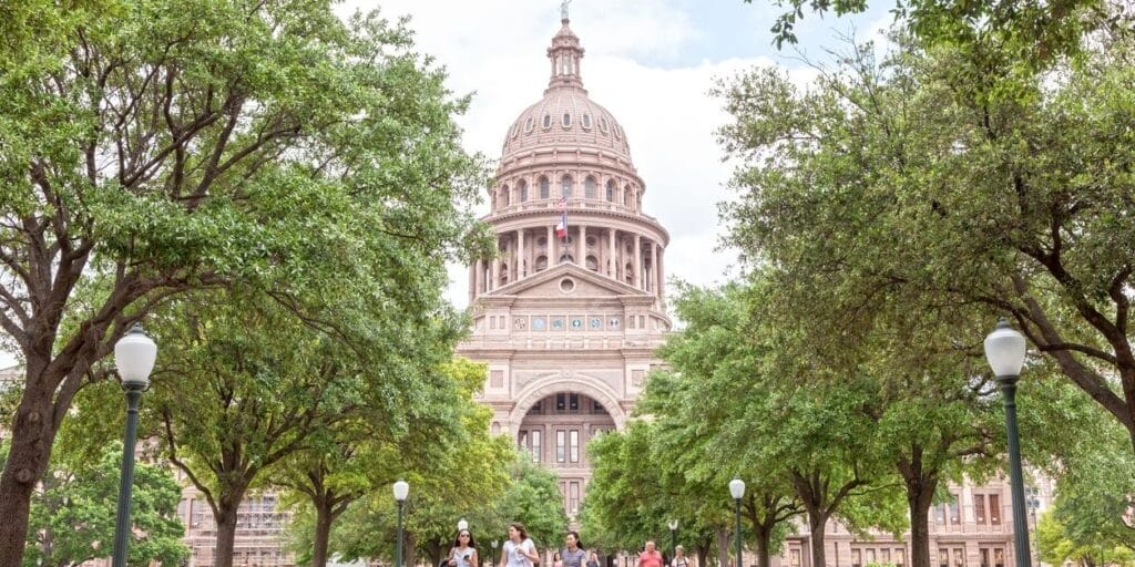 People in front of the Texas State Capitol building in Austin. 