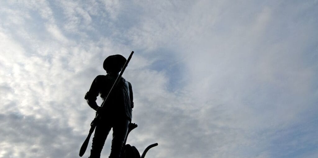 Silhouette of Revolutionary War Minuteman statue in Concord, Massachusetts.  