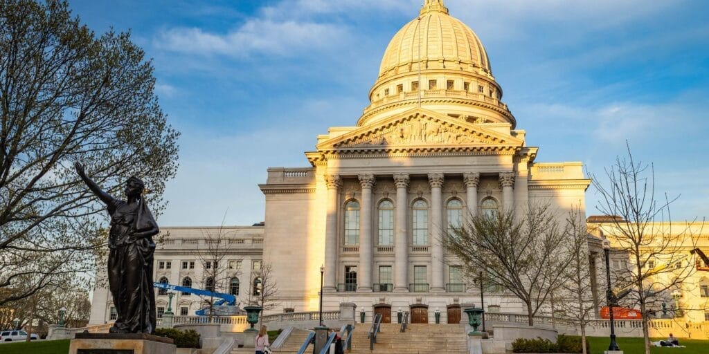 Madison, WI, USA - 05-04-2025: A vibrant sunset view of the Wisconsin State Capitol. 